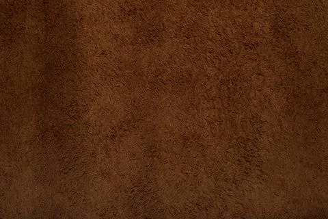 Brown suede leather texture background, genuine leather, top view. Stock Photos