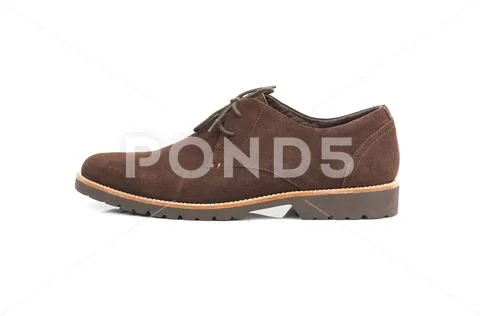 Brown suede men shoe isolated on a white background. Fashion advertising shoe Stock Photos