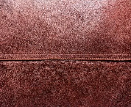 Brown suede texture background with seam. Stock Photos