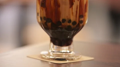 Brown Sugar Boba Milk Tea Macro Close-up Black Tapioca Pearls Chewy Texture Stock Footage 333604248
