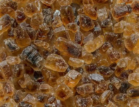 Brown sugar crystals. Stock Photos