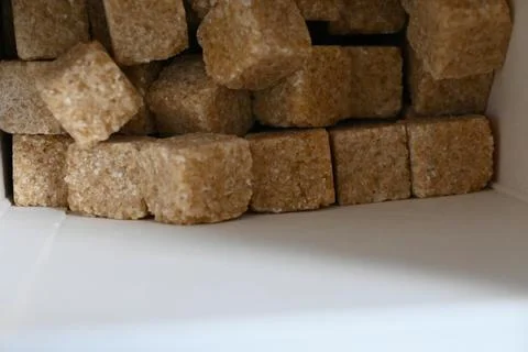 Brown sugar cubes in a box Stock Photos