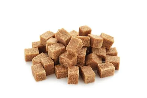 Brown sugar cubes isolated on white background Stock Photos