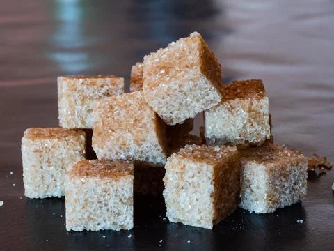 Brown sugar cubes Stock Photos
