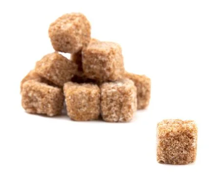 Brown Sugar Cubes on a White Background Stock Photos