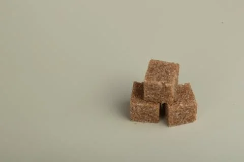 Brown Sugar cubes a white background. Stock Photos