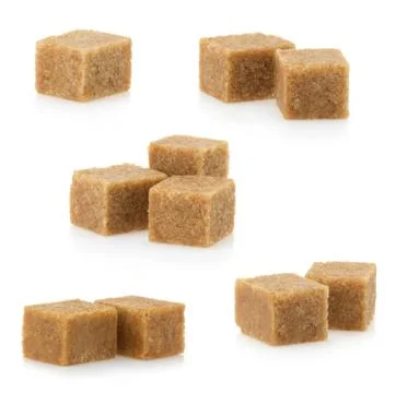 Brown sugar cubes on white Stock Photos