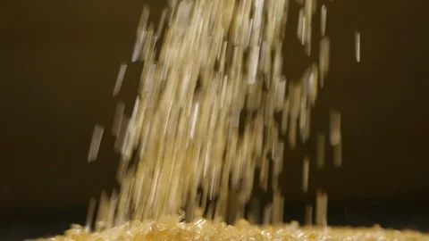 Brown sugar falling in slow motion, close-up Stock Footage 115142818