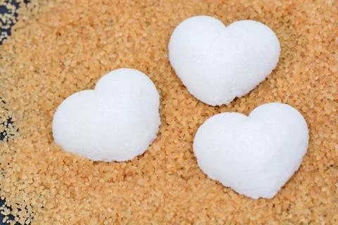Brown sugar with hearts shape 스톡 사진