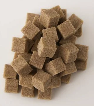 Brown sugar mess cubes of brown sugar stack in random fashion Copyright: x... Stockfoto's