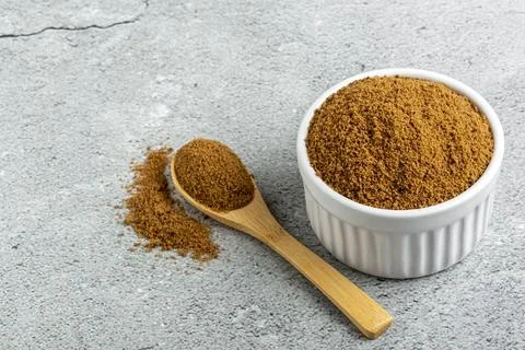 Brown sugar in ramekin on the table. Stock Photos