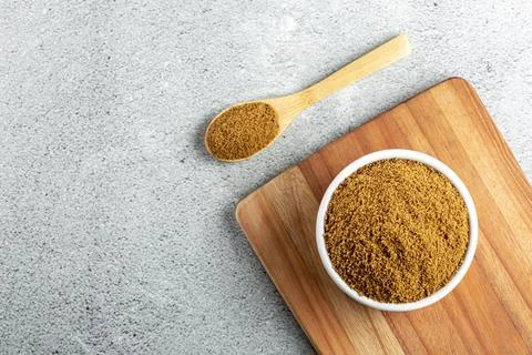 Brown sugar in ramekin on the table. Stock Photos
