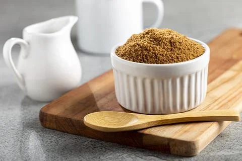Brown sugar in ramekin on the table. Stock Photos