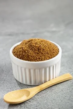 Brown sugar in ramekin on the table. Stock Photos