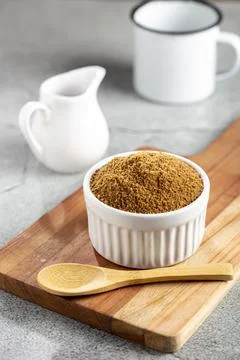 Brown sugar in ramekin on the table. Stock Photos