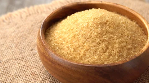 Brown sugar rotating on burlap. Rustic wooden background. Seamless loopable Stock Footage 67598428