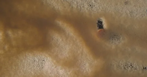 Brown sugar, sand, smiley drawn with hand from below 4K pro res Stock Footage 274906768