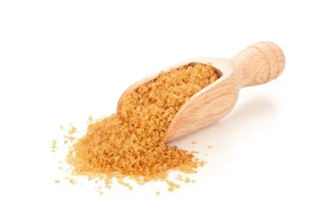 Brown sugar in scoop. Stock Photos