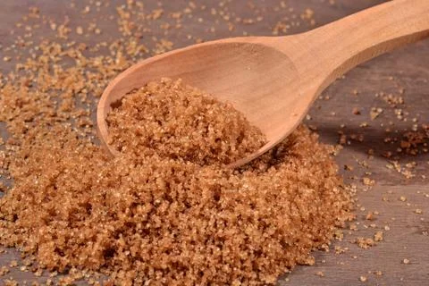 Brown sugar in a spoon Stock Photos