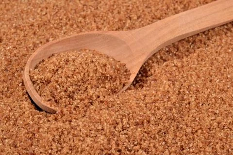 Brown sugar in a spoon Stock Photos