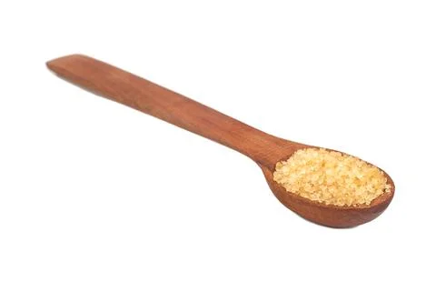 Brown sugar in spoon Stock Photos