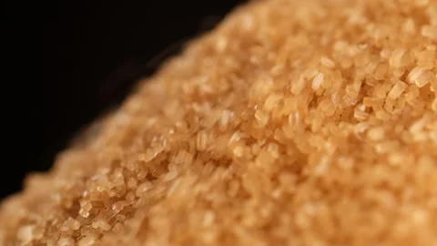 Brown sugar texture. Pouring cane sugar close up Stock Footage 244223456