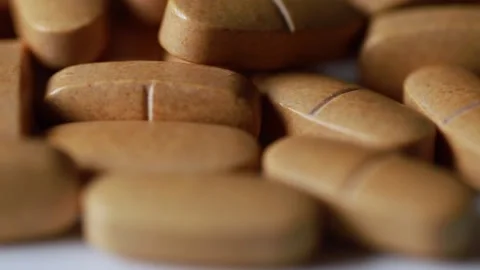 Brown tablets close up with movement Stock-Footage 148200676