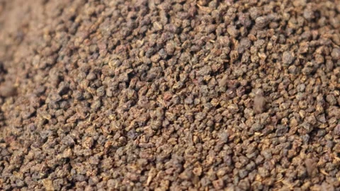 Brown tea leaves powder drops in a bowl rotation. 4K. Stock Footage 278343344