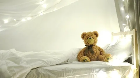 Brown teddy bear lyiing sick in bed 4k Stock Footage 72394837
