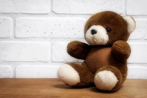 Brown teddy bear sitting on a table Stock Photos