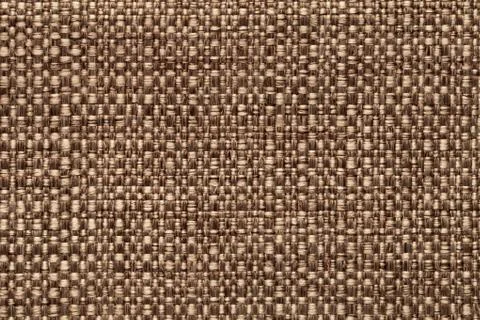 Brown textile background with checkered pattern, closeup. Structure of the fa Stock Photos