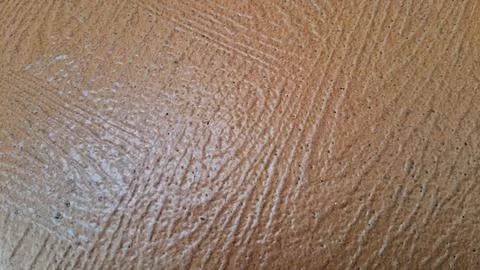 Brown textured floor tile surface with detailed grainy matte finish patterns 스톡 사진