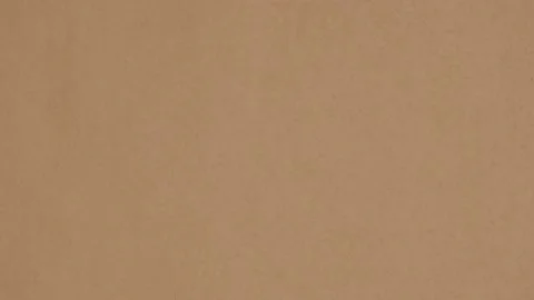 Brown textured sheet of сraft paper. Stop motion animation. Looping 4K video. Stock Footage 239444073