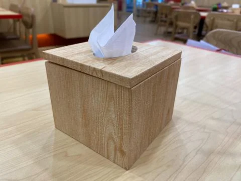 Brown tissue box on a table. usually in restaurants Stock Photos