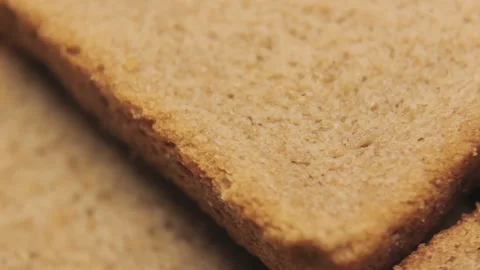 Brown Tommy Rotating Close Up To See The Porous Structure Of The Rye Bread Video stock 102686218