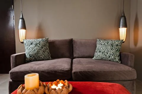 Brown two seated sofa dark ambience Stock Photos
