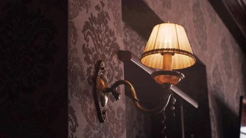 On the brown wall burning sconces Видео 159140099