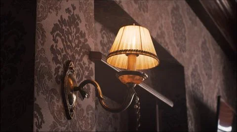 On the brown wall burning sconces Stock Photos