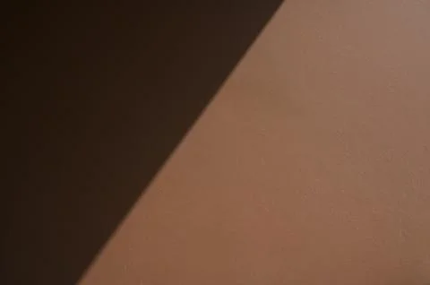 Brown wall textured background with shadow Foto stock