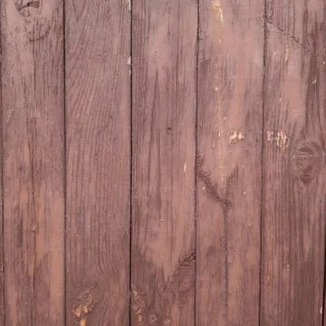 Brown wall of vertical boards Stock Photos