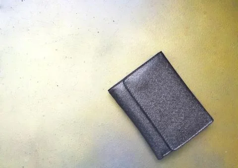 Brown wallet on a gold background Stock Photos