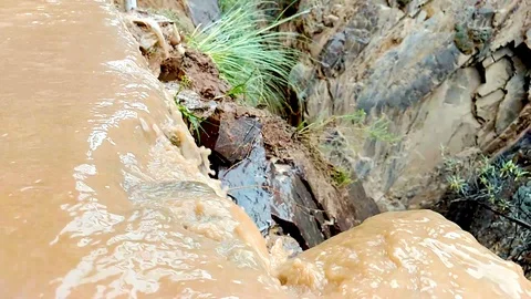 Brown water of river falling Stock Footage 105926414