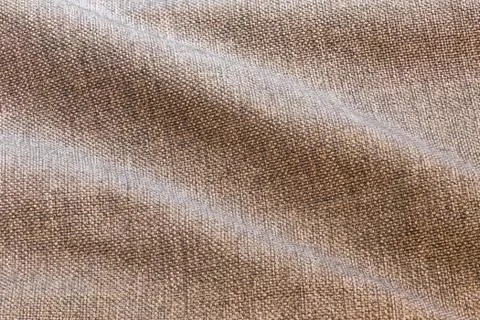 Brown waves dense rough fabric closeup background Stock Photos