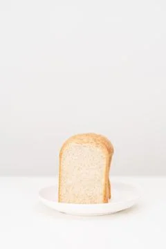 Brown whole wheat bread slice on plate. Weight loss management, Dieting, He.. Stock Photos