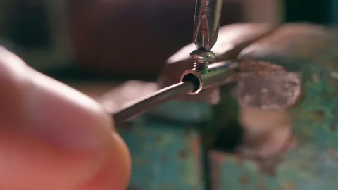 The brown wire is being prepared for connection to the plug close-up. Clamp the Stock Footage 211792133