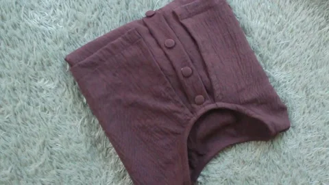 Brown women's blouse. Video stock 276587189