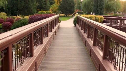 Brown wooden solid bridge in autumn yellow park. Stock Footage 165305393