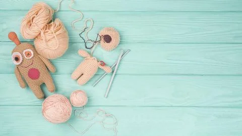 Brown wool doll green background. High quality beautiful photo concept Stock Photos