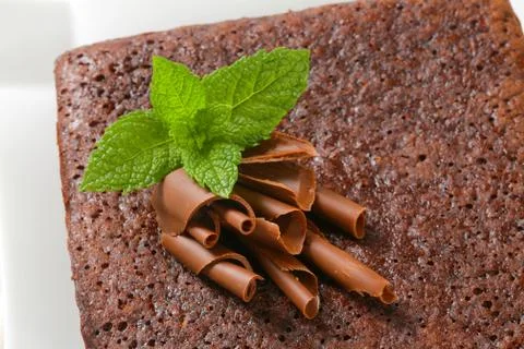 Brownie topped with chocolate curls Stock Photos