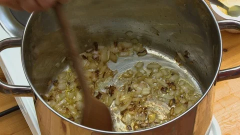 Browning Onions in Large Pot Stock Footage 115609541